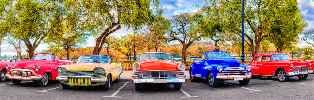 Colorful group of classic cars in Old Havana, a typical attraction of Cuba