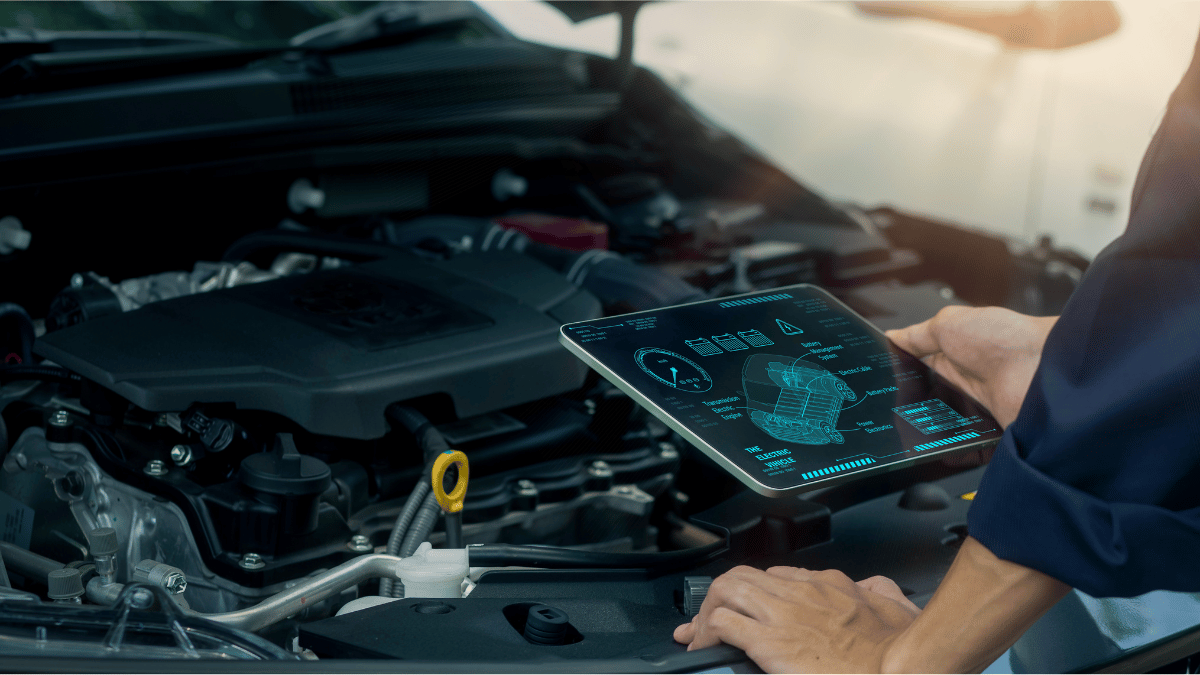 A mechanic working on an electric vehicle
